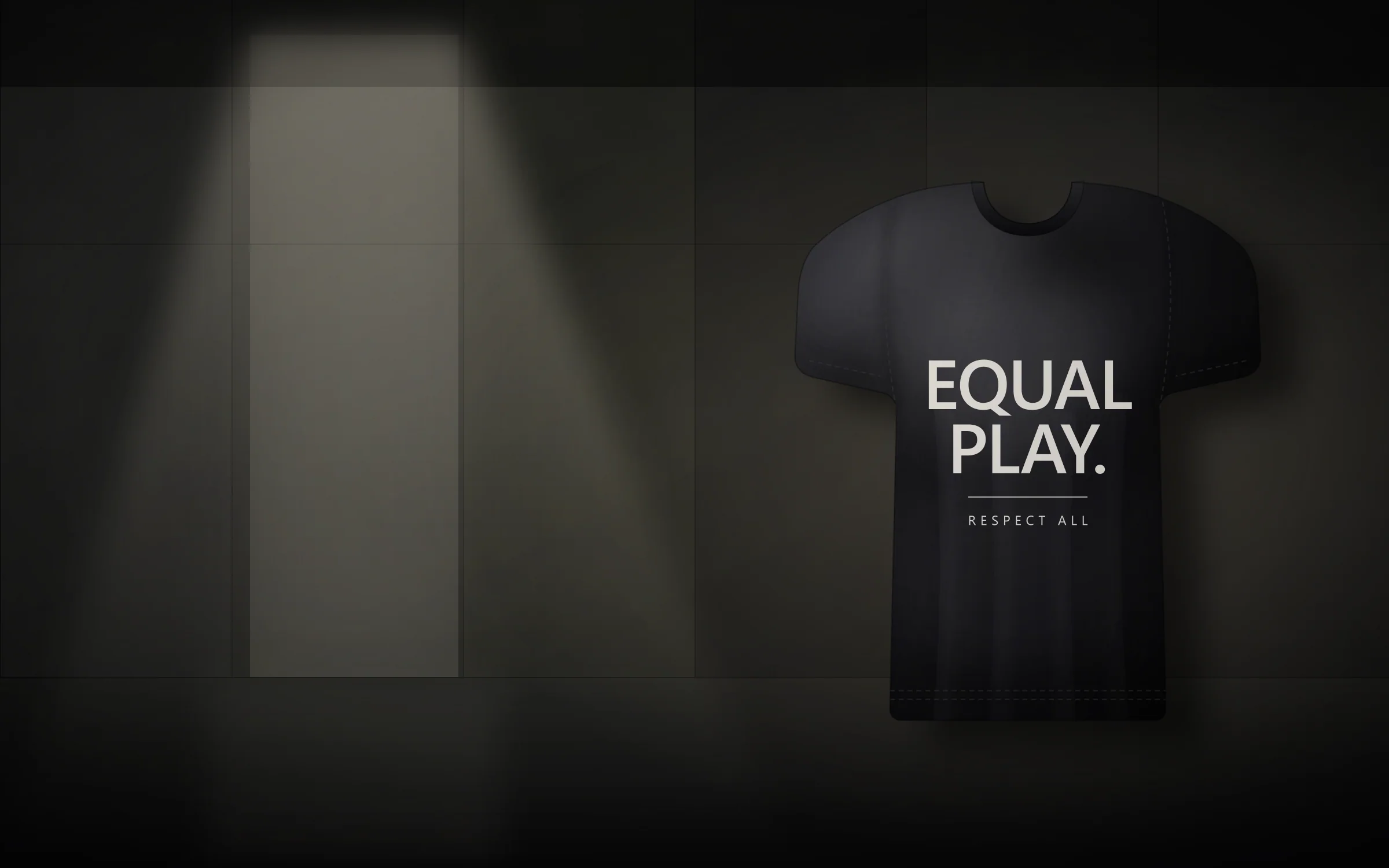 Everything Fair Statement T-shirt suspended in a dark concrete interior beside a lit doorway